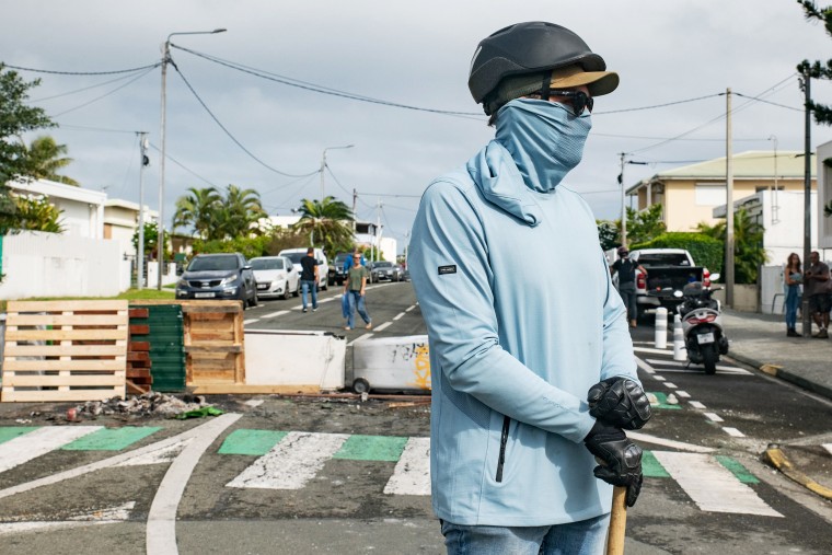 One person was killed, hundreds more were injured, shops were looted and public buildings torched during a second night of rioting in New Caledonia, authorities said Wednesday.