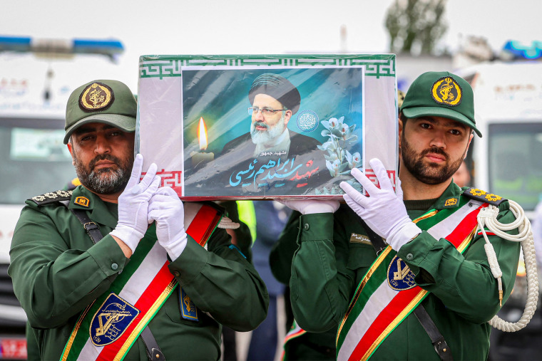 Guards carrying the coffin of late president Ebrahim Raisi 
