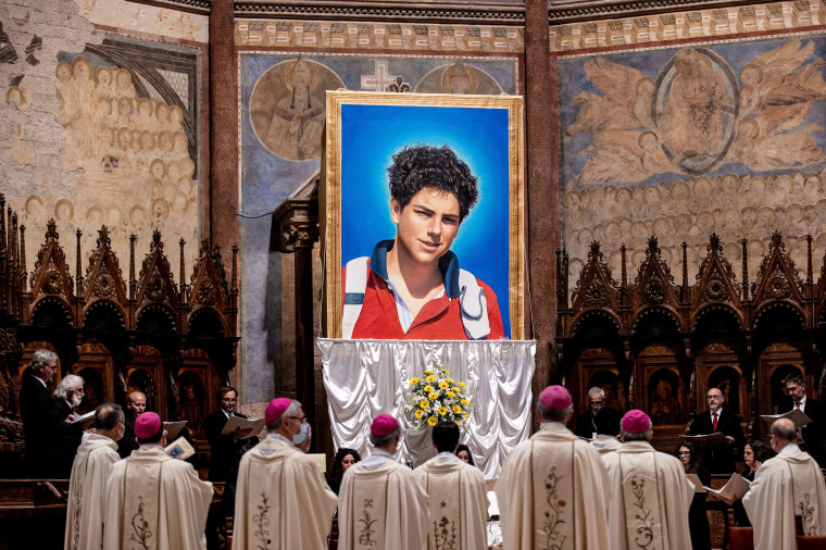A tapestry featuring a portrait of Carlo Acutis hangs at the St. Francis Basilica during his beatification ceremony on Oct. 10, 2020 in Assisi, Italy. 