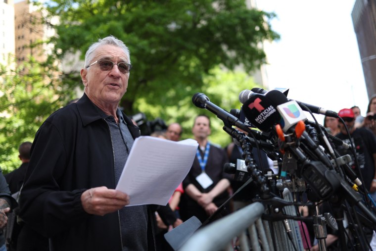 Robert De Niro reads a statement during a press conference outside of Manhattan Criminal Court.