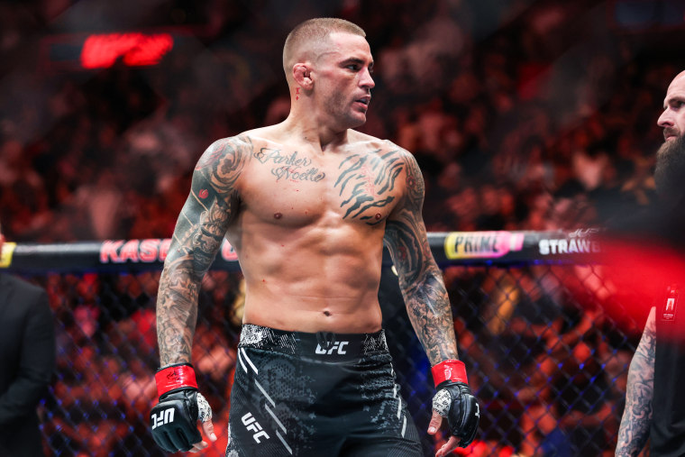 Dustin Poirier stands inside of the fighting ring