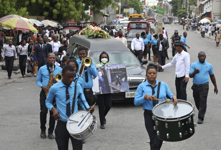 A funeral procession for mission director Judes Montis