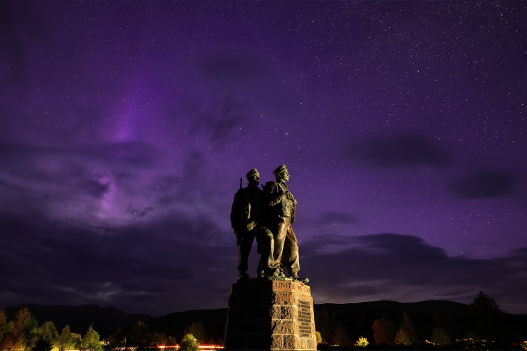 A general view of the Commando Memorial as the aurora borealis, commonly known as the northern lights, are visible in the early hours on May 12, 2024 in Spean Bridge, Scotland. 