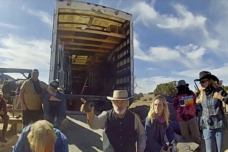 In this image taken from video released by the Santa Fe County Sheriff's Office, Alec Baldwin gestures while talking with investigators following a fatal shooting on a movie set in Santa Fe, New Mexico in 2021.