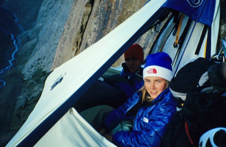 Beth and Tommy in Portaledge in a tent on the side of a cliff
