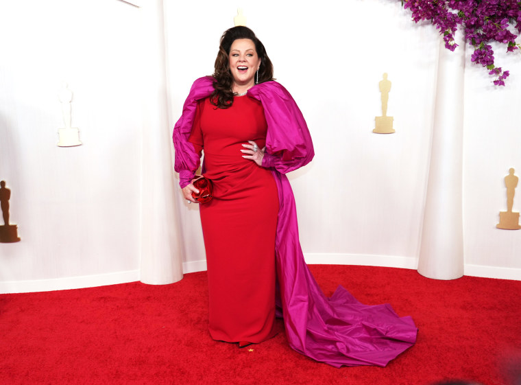 Melissa McCarthy walks the red carpet during the 96th Academy Awards in Hollywood.