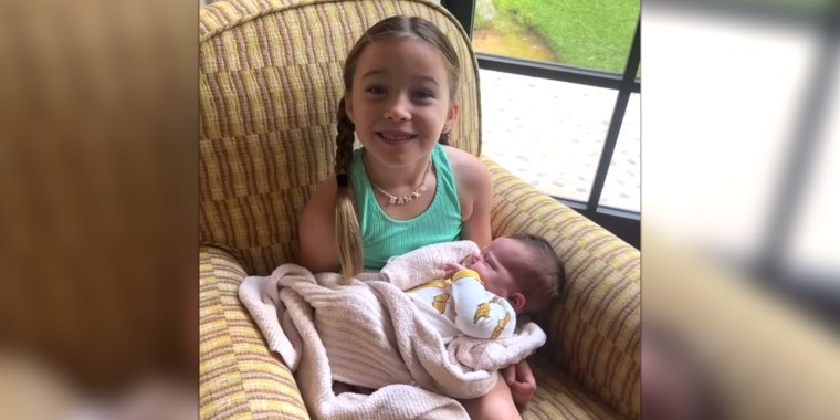 Hilary Duff's daughter, Banks, proudly holds her new baby sister!
