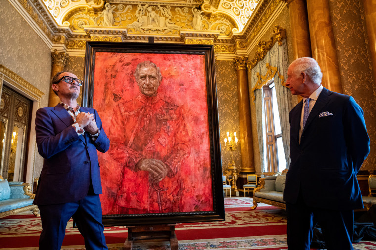 Artist Jonathan Yeo and King Charles III stand in front of the portrait of the King Charles III as it is unveiled in the blue drawing room at Buckingham Palace. The artwork depicts the King wearing the uniform of the Welsh Guards, of which he was made Regimental Colonel in 1975. The canvas size - approximately 8.5 by 6.5 feet when framed - was carefully considered to fit within the architecture of Drapers' Hall and the context of the paintings it will eventually hang alongside.