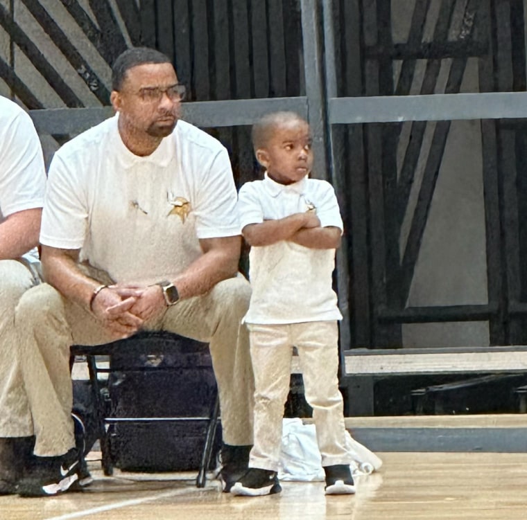 Coach Chris Bess and son at basketball game.