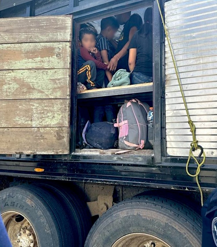 A group of Guatemalan migrant children travel in a crowded cargo truck in the town of Yanga, Veracruz, on October 19, 2023.