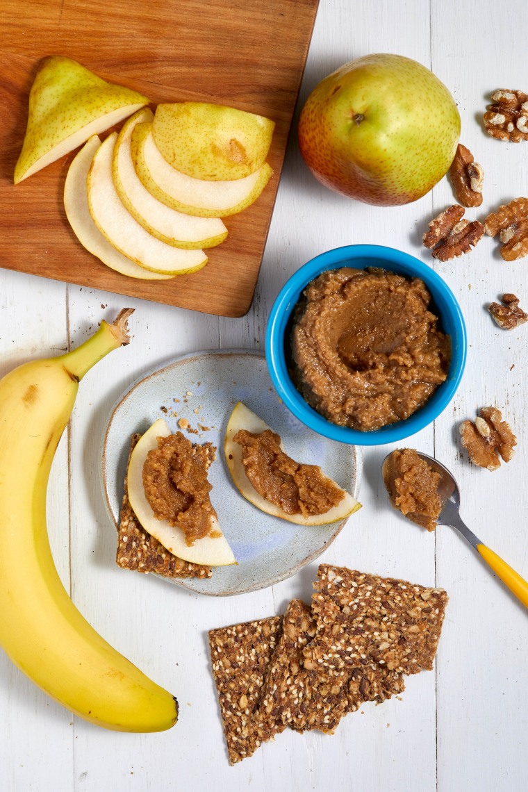 oatmeal cookie walnut butter with apples and bananas shot from above.