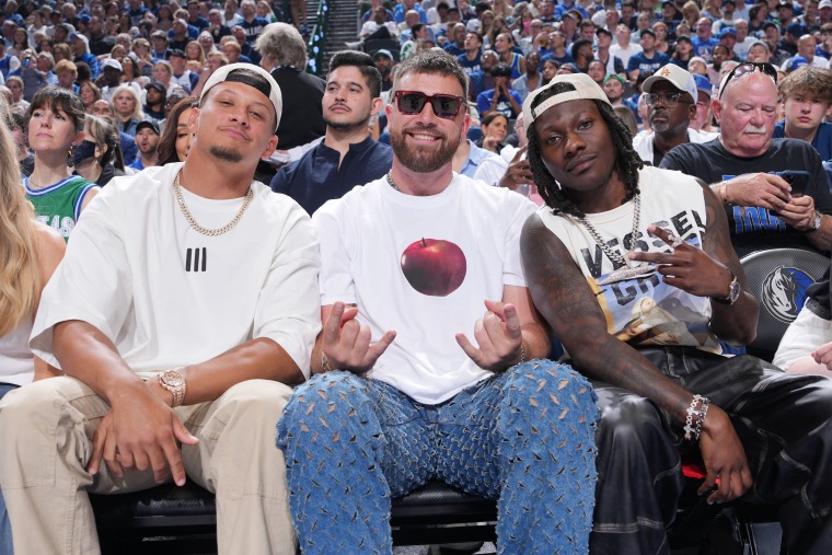 Patrick Mahomes, Travis Kelce, and Marquise Brown sit court atthe Minnesota Timberwolves and the Dallas Mavericks Game 3 of the Western Conference Finals of the 2024 NBA Playoffs on May 26, 2024 at the American Airlines Center in Dallas.