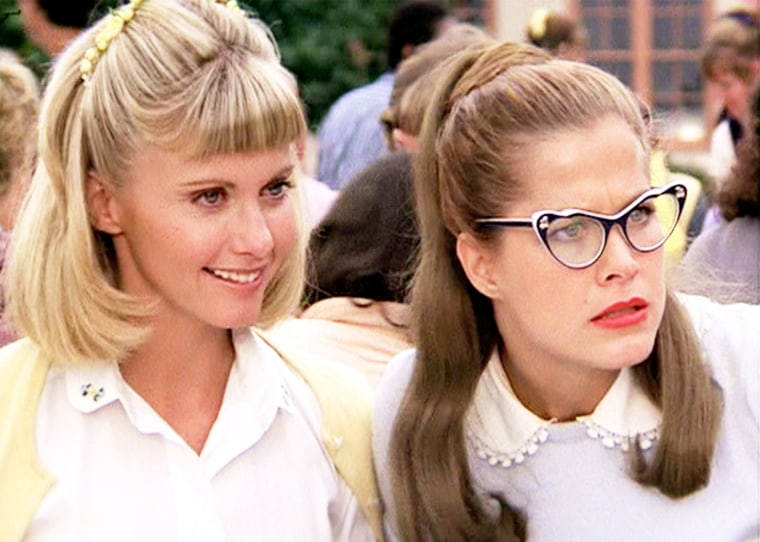 Olivia Newton-John as Sandy and Susan Buckner as Patty in the movie "Grease."