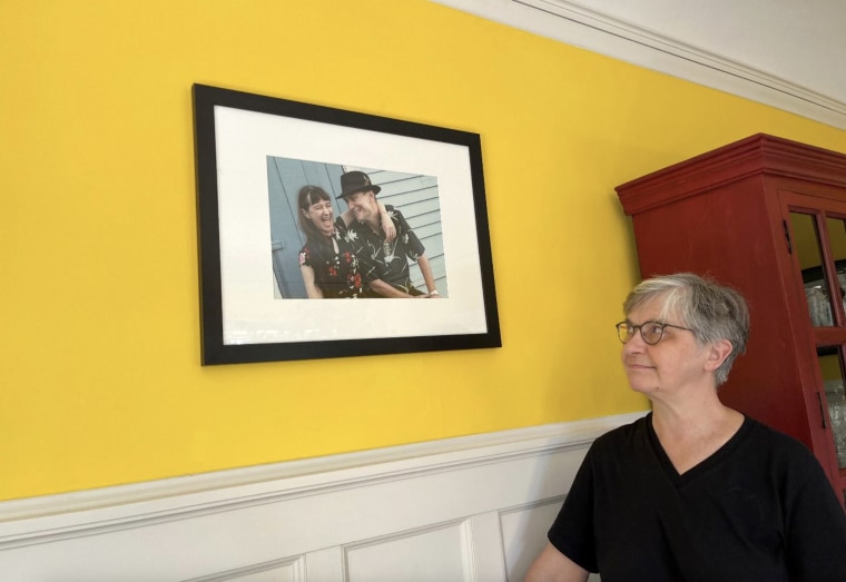 Ruby Blondell looks at a photo of herself with her late husband, Douglas Roach, taken before they were married in 2004. “He was very upset that we weren't going to have the life together we’d planned,” she said. 