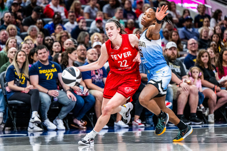 Indiana Fever guard Caitlin Clark makes contact with Chicago Sky guard Lindsay Allen on the basketball court