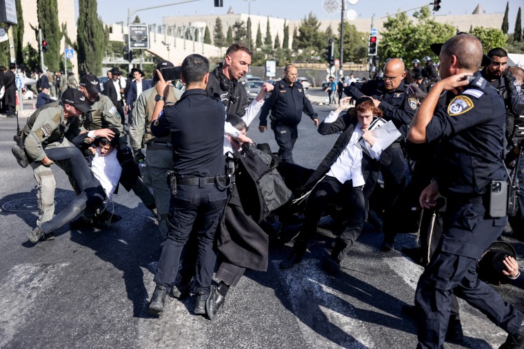 Security forces arrest protestors on the street