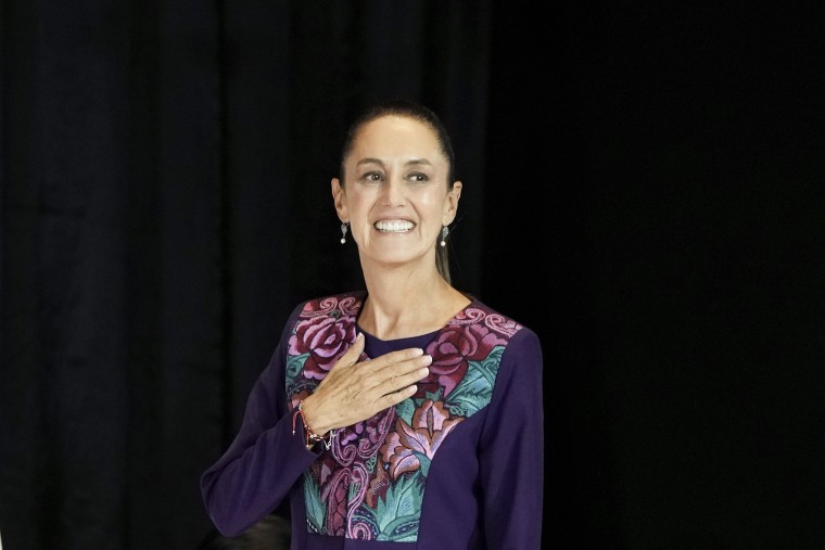 Ruling party presidential candidate Claudia Sheinbaum greets supporters after the polls closed during general elections in Mexico City, on June 3, 2024.