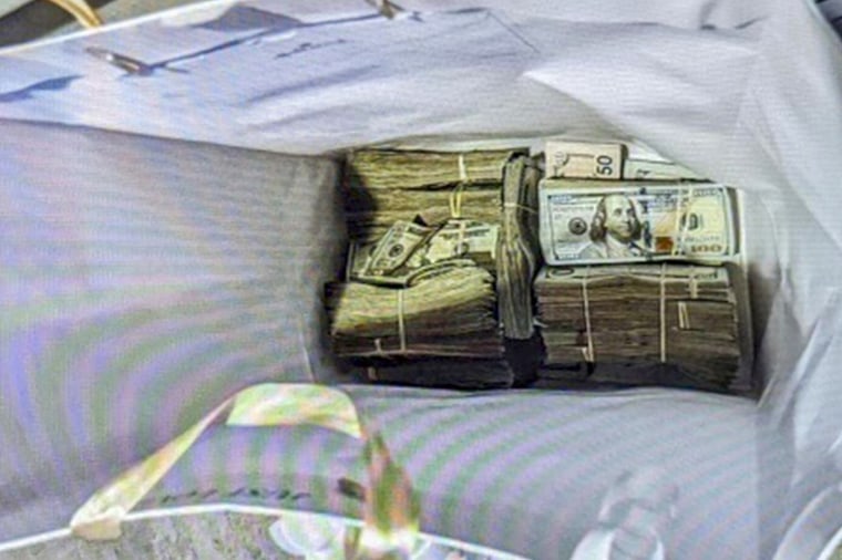 Cash from a bag that was left at the home of a juror in a fraud case, on June 2, 2024, in Minneapolis.