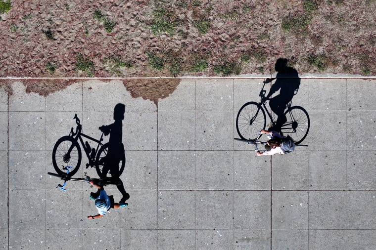 The shadow of cyclists.