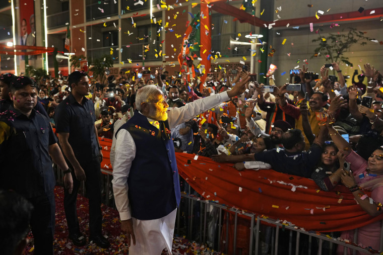 Narendra Modi greets supporters in New Delhi