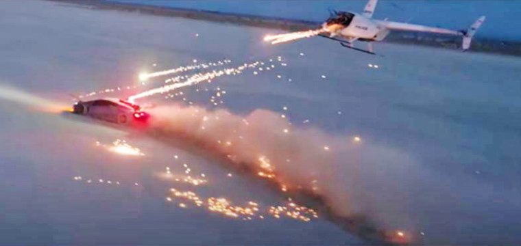A scene from the video "Destroying a Lamborghini with Fireworks."
