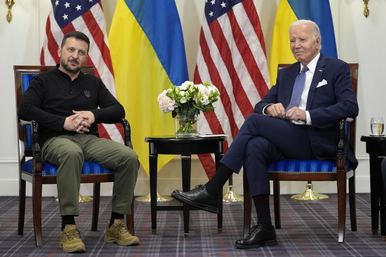 Joe Biden, right, meets with Volodymyr Zelenskyy in Paris