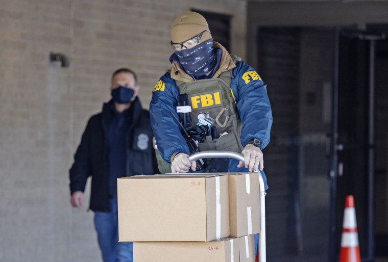 The FBI raids Feeding our Future in St. Anthony, Minn., on Jan. 20, 2022. 
