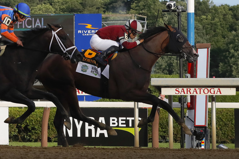 Dornoch, (6), with Luis Saez up, crosses the finish line ahead of Mindframe (10), with Irad Ortiz Jr. up, to win the 156th running of the Belmont Stakes horse race