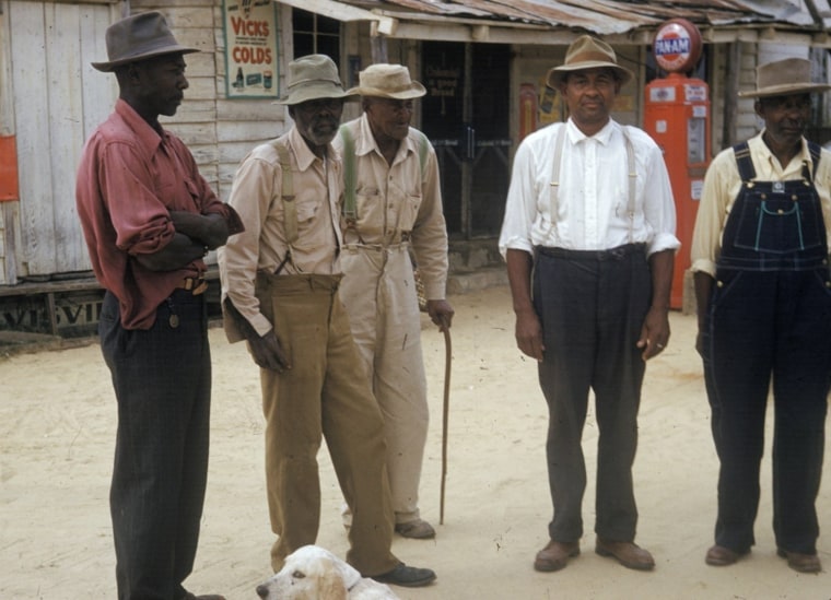 Image: Men included in a syphilis study pose for a photo in Tuskegee, Ala., in the 1950's