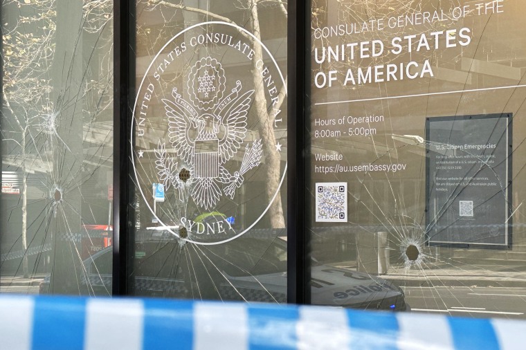 Nine windows were damaged with the hammer and red symbols spray painted on the doors of the North Sydney building about 3am on Monday as a person wearing a dark-coloured hoodie use a sledgehammer to try and break the windows of the consulate. 