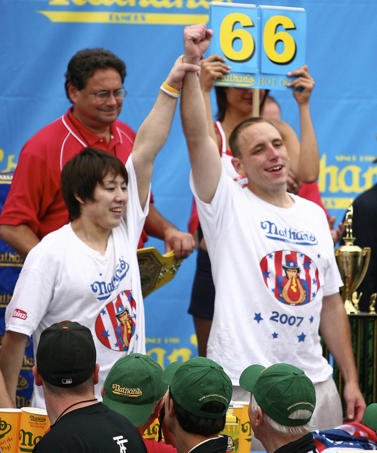 Second place contestant Takeru Kobayashi of Japan and winner Joey Chestnut at Nathan's Famous hot dog eating contest on July 4, 2007. 