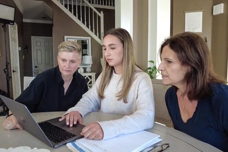 Stacey Hachenberg, left, and her partner, Sharon Fleming, right, review long-term care options with the help of Fleming’s daughter, Alexa Fleming, center.