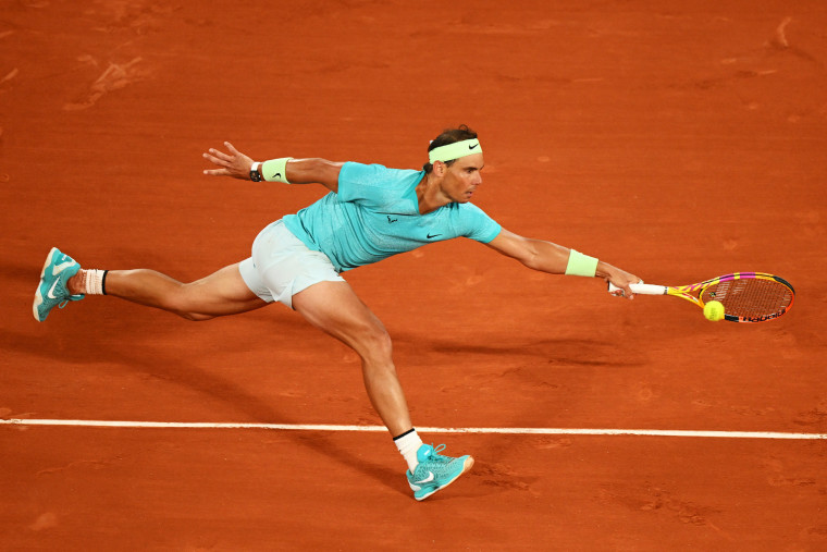 Rafael Nadal of Spain stretches for a forehand