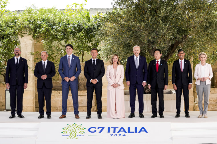 From left, Charles Michel, Olaf Scholz, Justin Trudeau, Emmanuel Macron, Giorgia Meloni, Joe Biden, Fumio Kishida,  Rishi Sunak and Ursula von der Leyen.