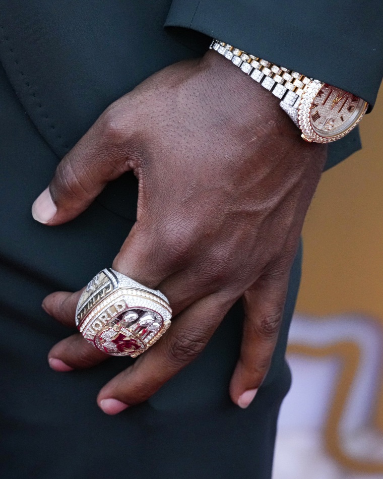 The hand with rings of Kansas City Chiefs running back Isiah Pacheco.