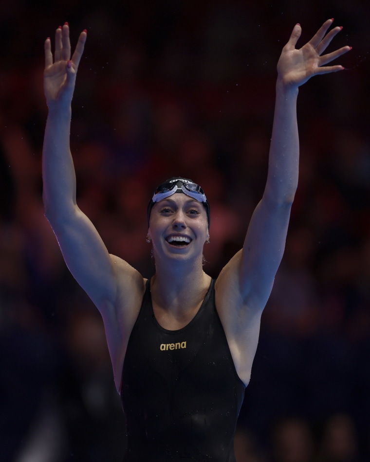 Gretchen Walsh celebrates after breaking the world record in the women's 100m butterfly semifinal