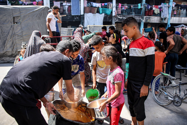 Children queue for food aid in the northern Gaza Strip.