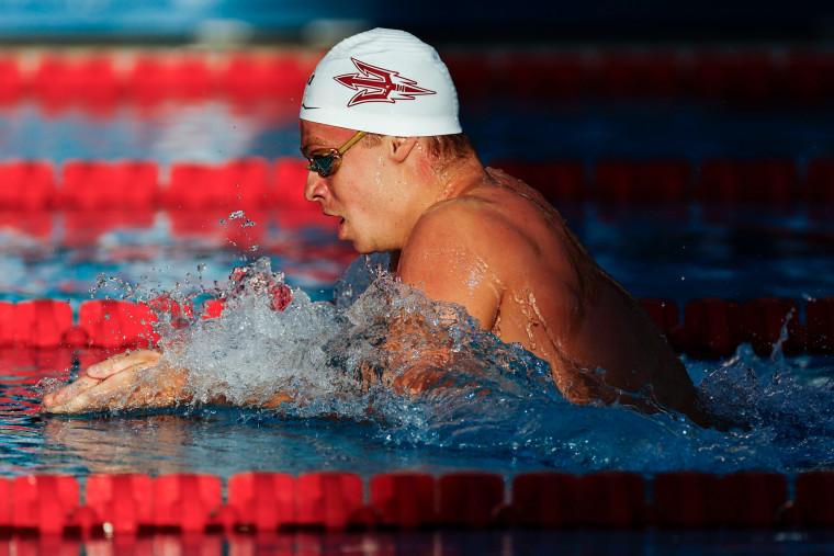 Leon Marchand swims in a pool during a competition