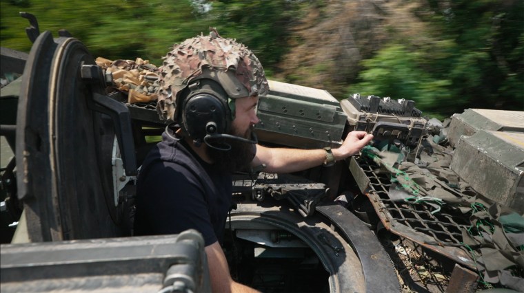 Dmytro Pryimak onboard an Abrams tank close to the front lines in Ukraine's eastern Donetsk region. 