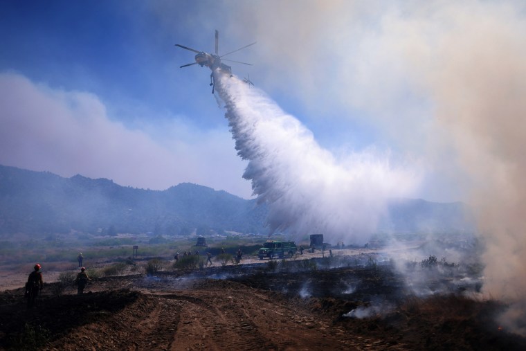 Air support drops water near the Post Fire