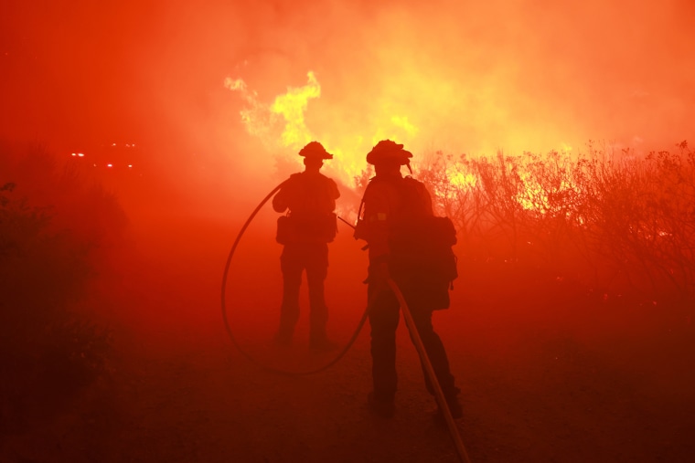 Firefighters respond to the Post Fire as it burns through the Hungry Valley State Vehicular Recreation Area in Lebec, Calif., on June 16, 2024.