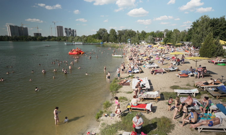 Revellers enjoy the weather at a beach in Kharkiv, Ukraine on June 9, 2024.