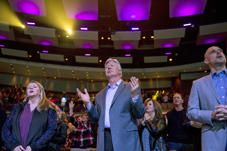 Robert Morris, center, founding pastor of the megachurch Gateway, during a service at the church in Fort Worth, Texas.