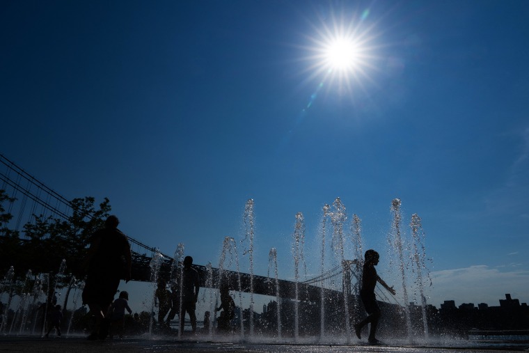 Extreme heat and high humidity smothered the central and northeastern United States on Tuesday, with temperature records expected to melt away in the coming days, authorities warned, as wildfires sizzled in the west.