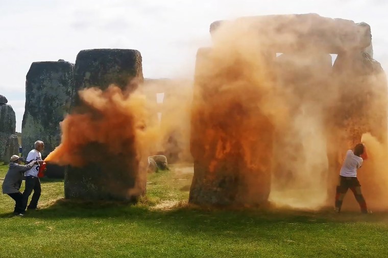 UK police said officers had arrested two people after environmental activists sprayed an orange substance on Stonehenge, the renowned prehistoric UNESCO World Heritage Site in southwest England.