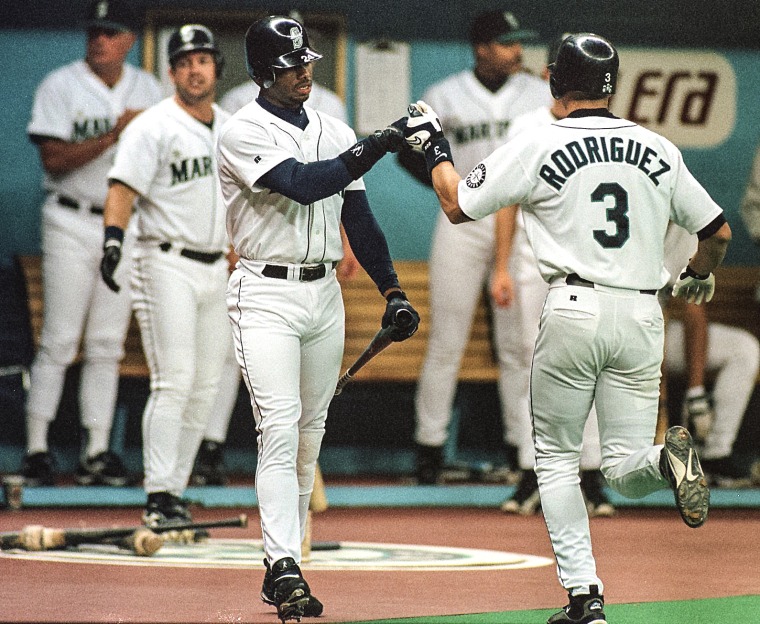 Seattle Mariner Alex Rodriguez, right, is congratulated by Ken Griffey Jr. ,