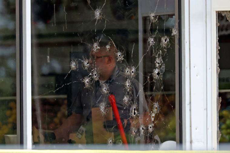 Bullet holes in the window of the store