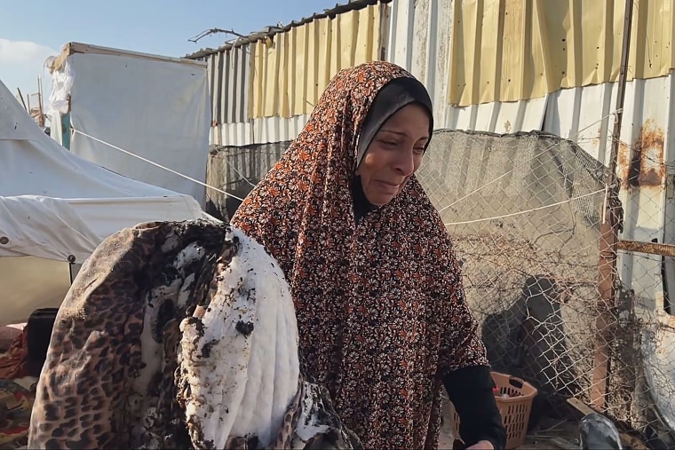 Asma Al Sarafendi speaks to an NBC News crew after an Israeli strike in Al-Mawasi early Wednesday. 