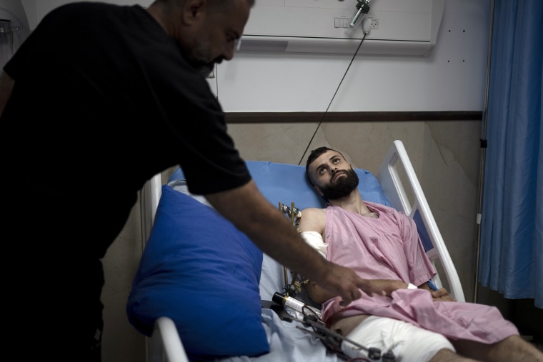 When the Palestinian man stepped outside to see if Israeli forces had entered his uncle's neighborhood, he was shot in the arm and the foot. That was only the start of his ordeal. Hours later, beaten and bloodied, he found himself strapped to the searing hood of an Israeli military jeep driving down a road.