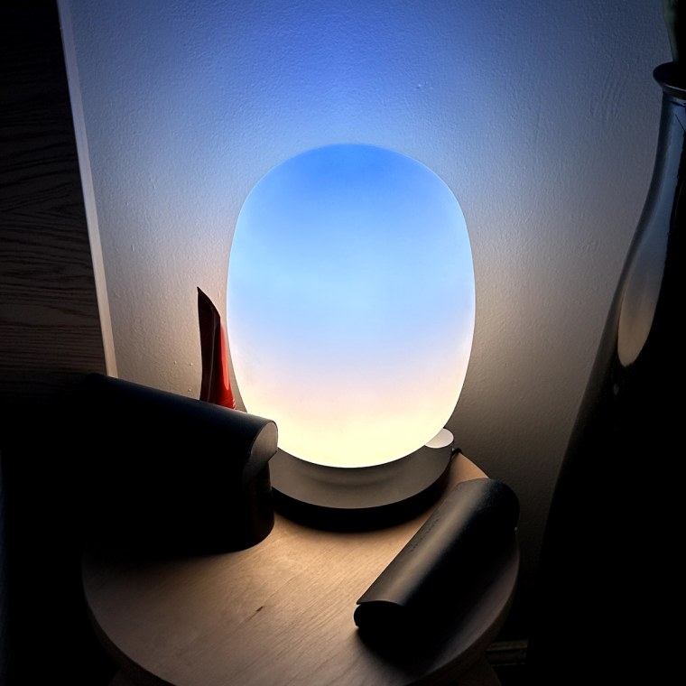 Skyview light illuminates on a bedside table with a blue gradient appearance.